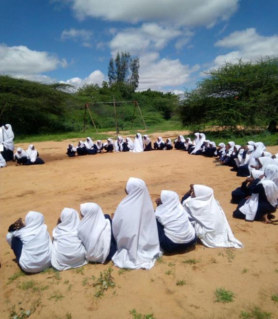 Girls at the schools compound for co curriculum activities. Girls at the schools compound for co curriculum activities.